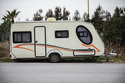 a travel trailer on the side of a road