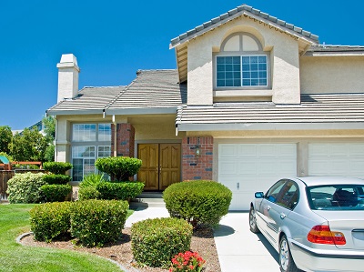 A nice house with a car in the driveway