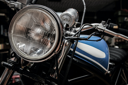 a motorcycle parked in front of a mirror